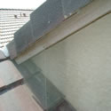 Front view of bird screen to prevent pigeons from nesting in these common areas that most homes have on their roof top.